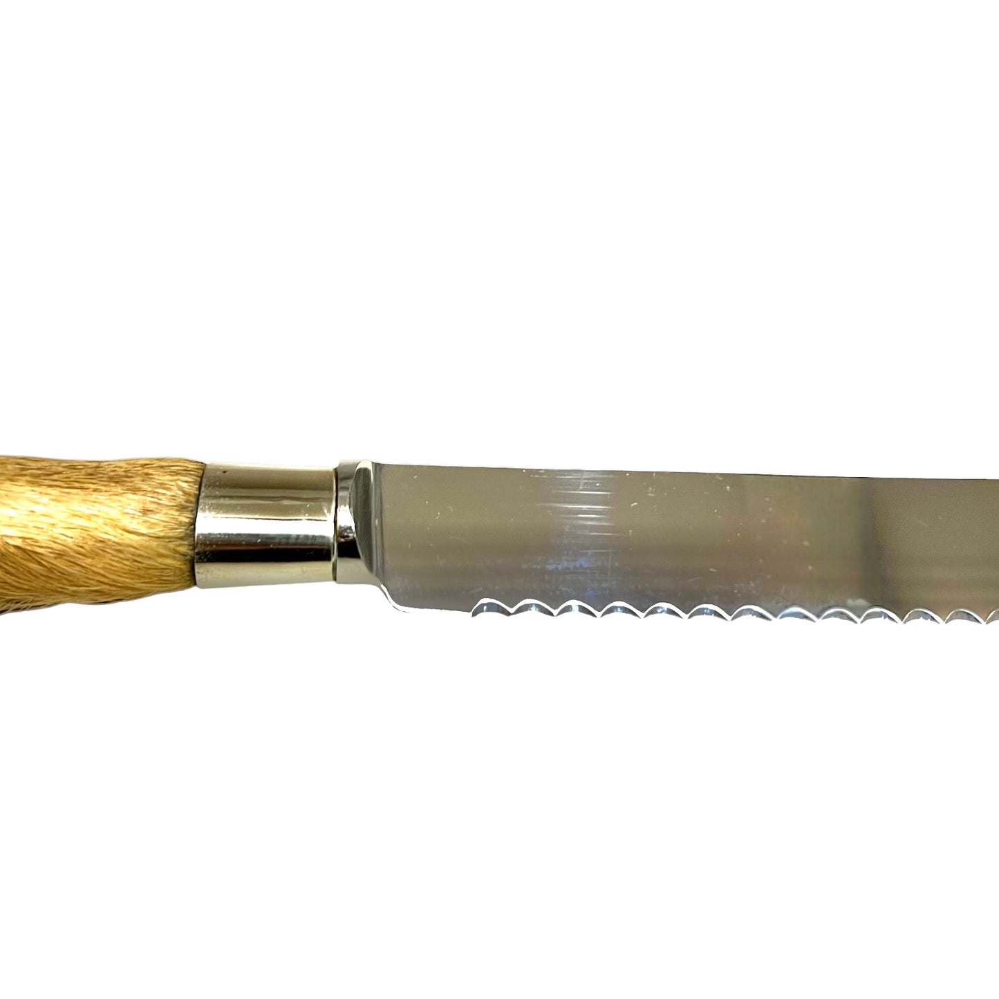 A close-up side view of a serrated bread knife with a polished steel blade and a light brown natural fur handle, set against a plain white background.