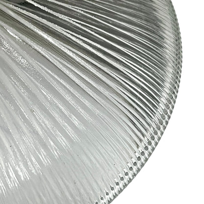 Close-up of a ribbed glass lampshade with reflective surface