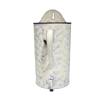 A vintage-style enamel pitcher with a white body, blue crackle-style veining, a white handle, and a matching white lid with a hanging loop, set against a plain white background.
