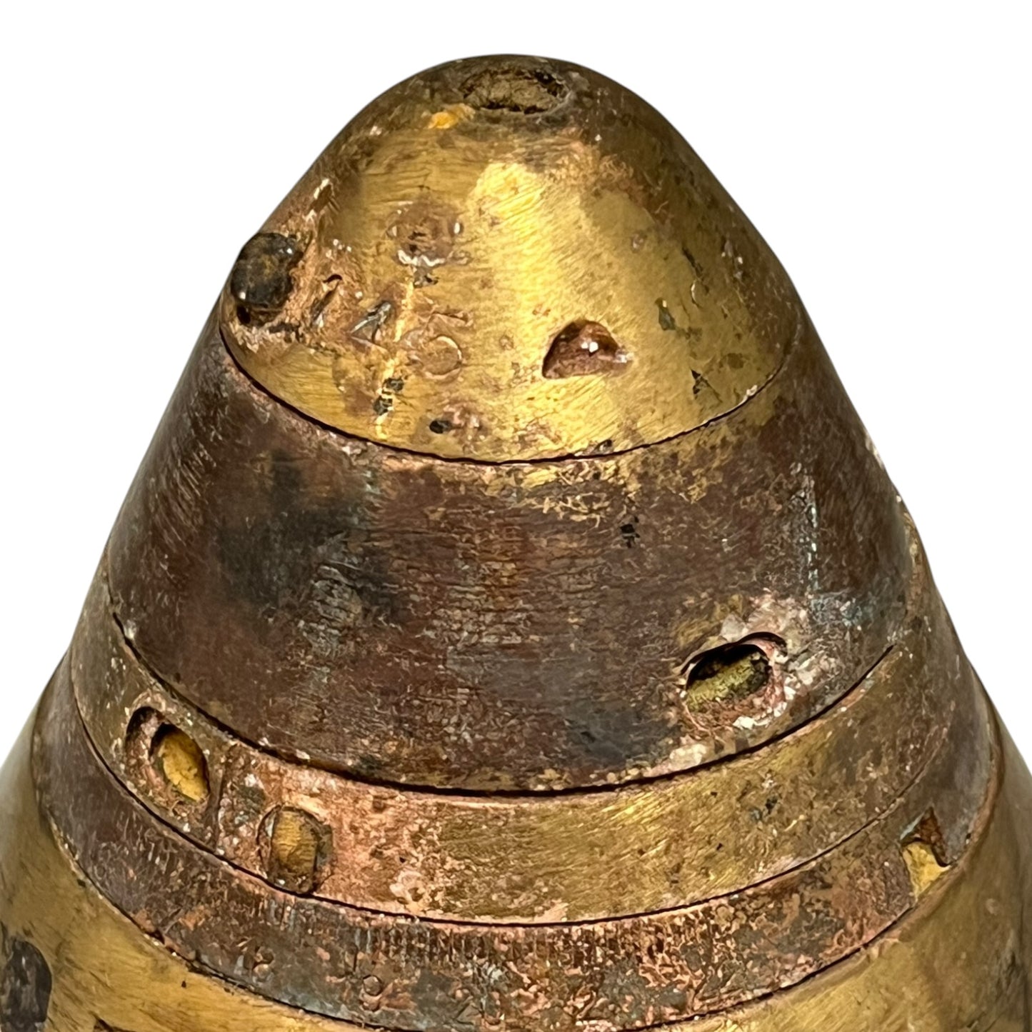 Close up of WW1 brass fuse on a white background