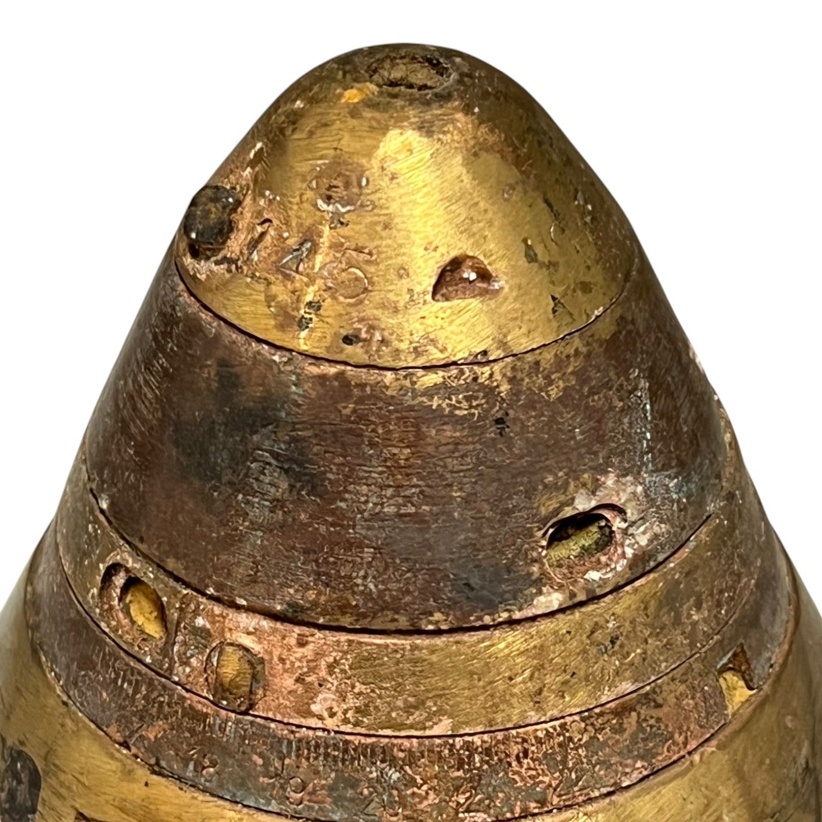 Close up of WW1 brass fuse on a white background