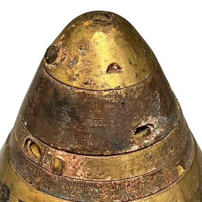 Close up of WW1 brass fuse on a white background