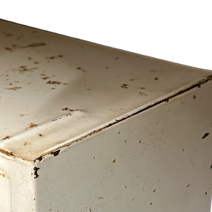 close up of a vintage metal bathroom cabinet