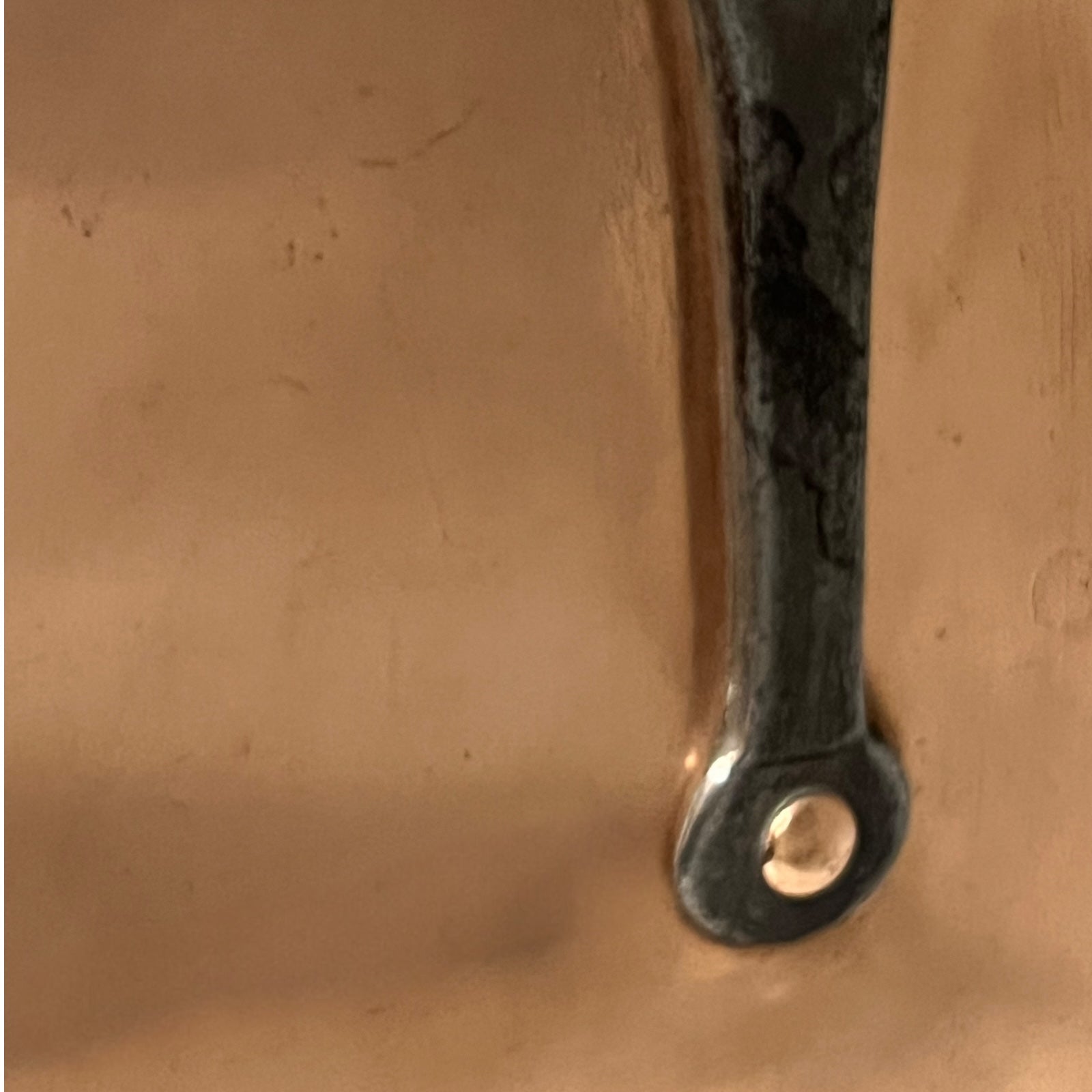 cast iron handle with copper rivets of copper pan lid