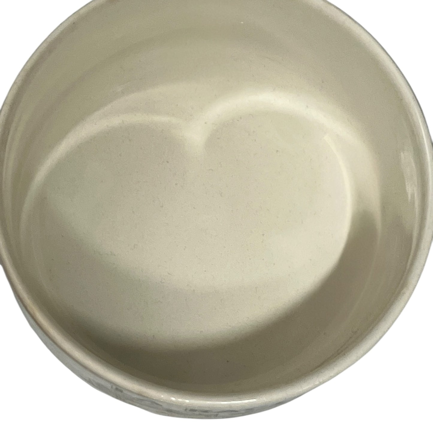 Beige ceramic bowl on a white background