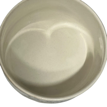 Beige ceramic bowl on a white background