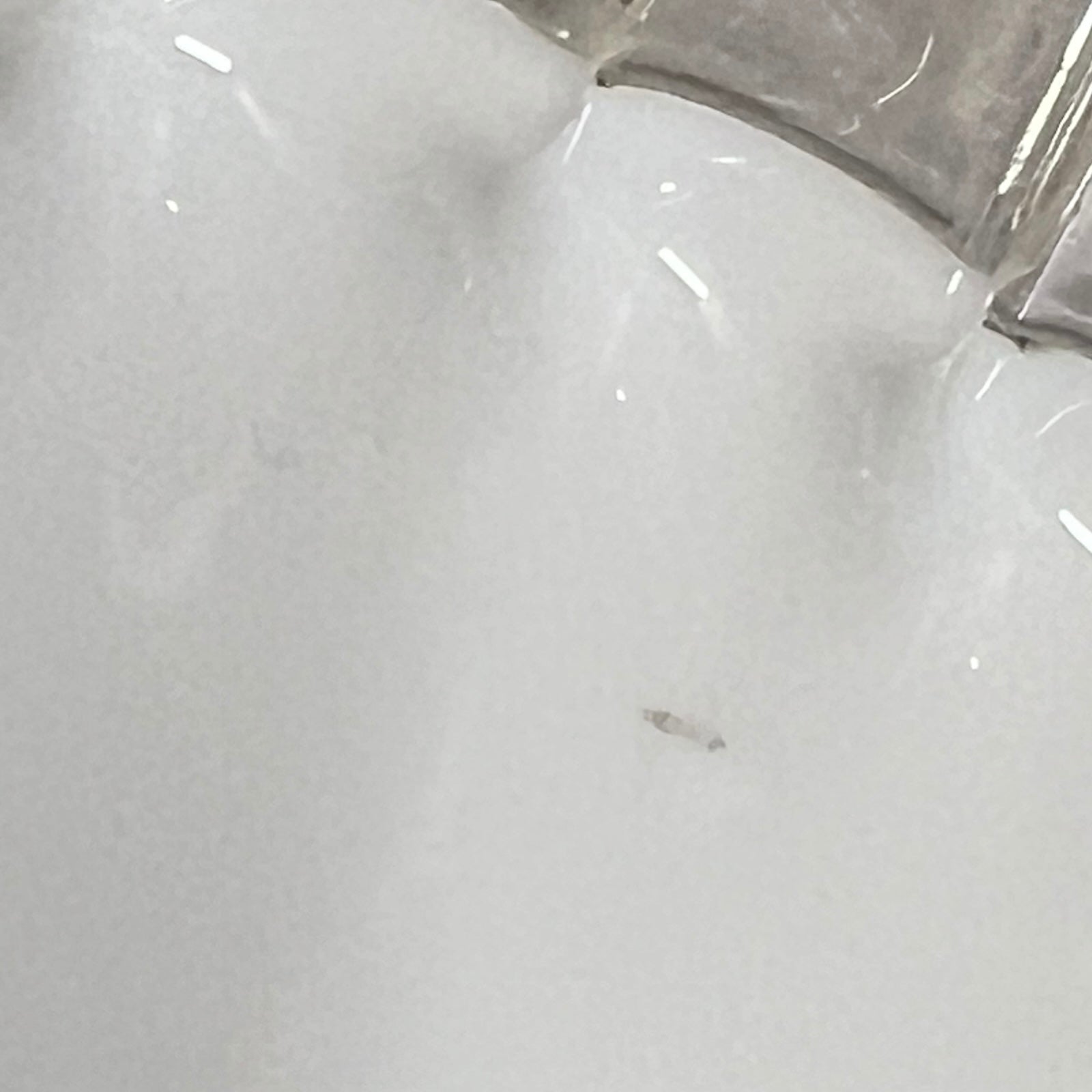 close up of lampshade rim on a white background