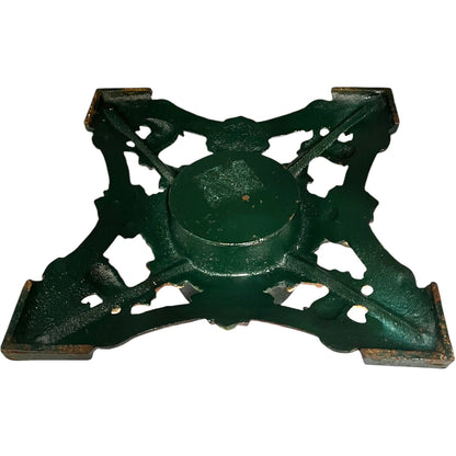 Close up of cast iron Christmas Tree holder on a white background