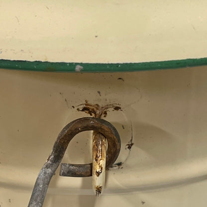 Close up of a French enamel bucket on a white background 