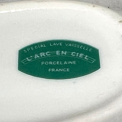 Porcelain dish with 'L'Arc-en-Ciel' branding on a white background