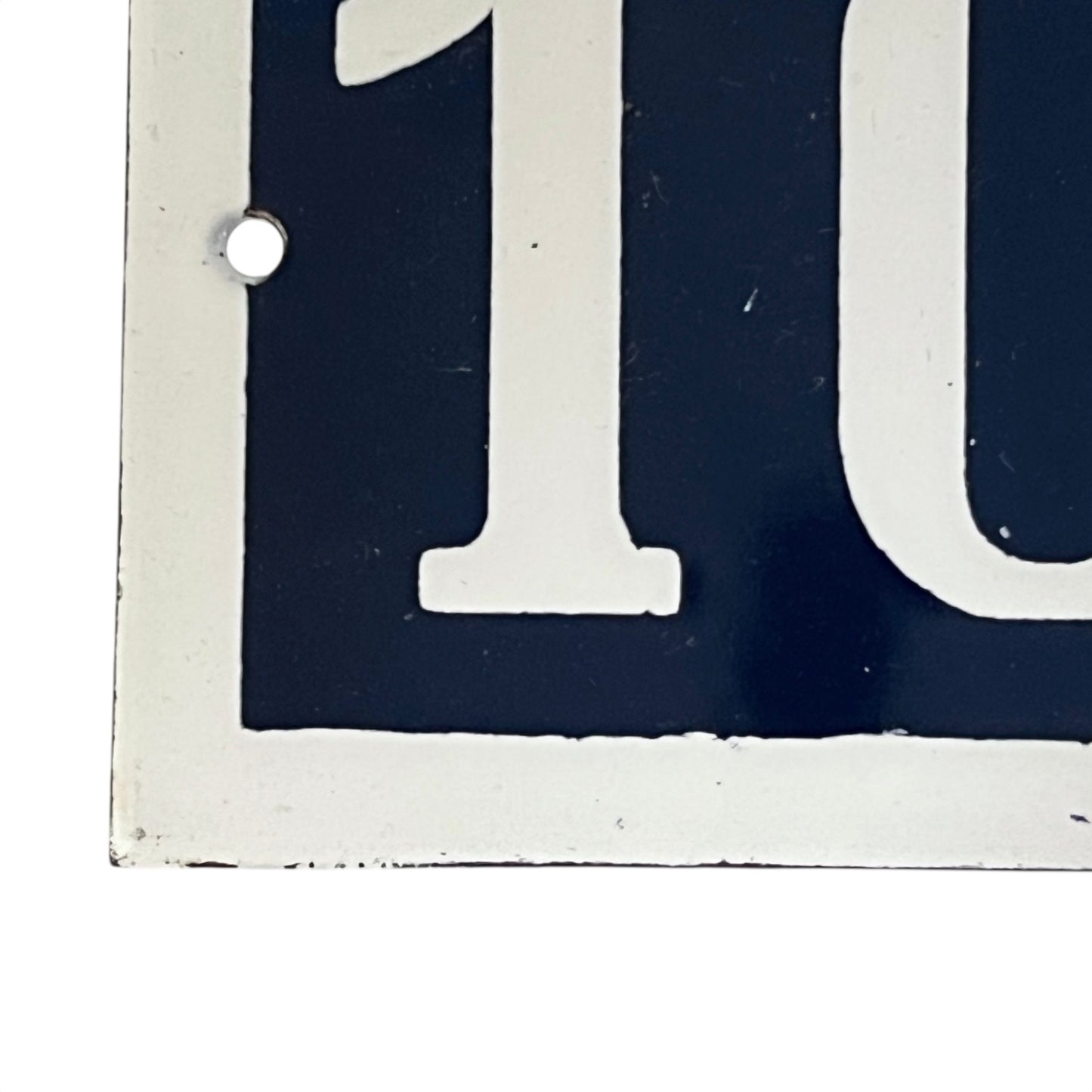 Close-up of a vintage-style sign with the number on a white background