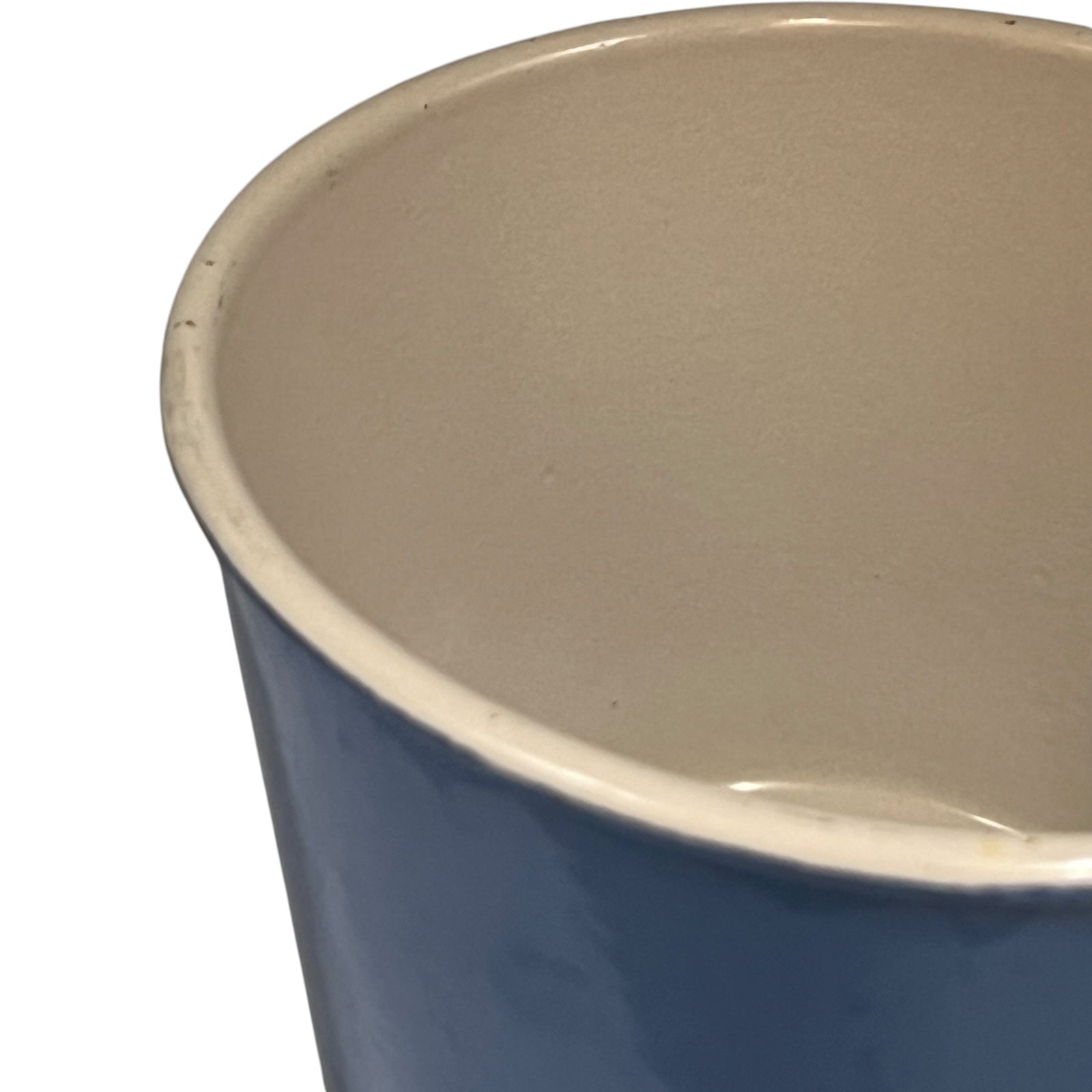 close up of  cast iron pan with beige interior on a white background