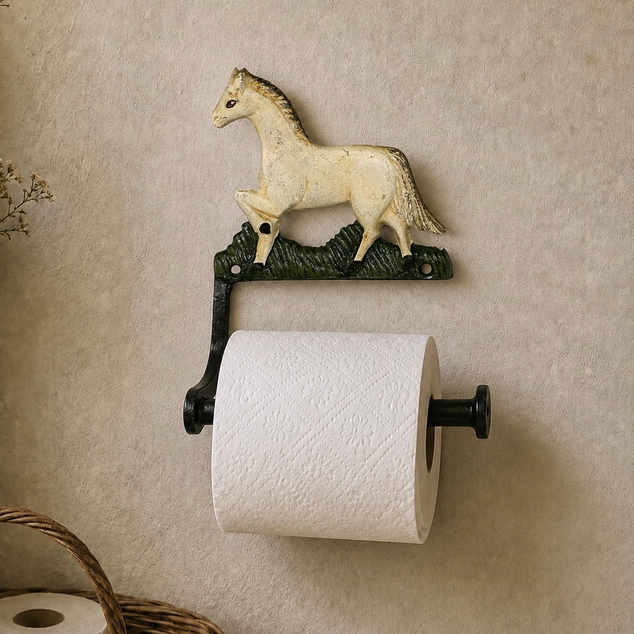 A wall-mounted toilet paper holder with a decorative horse-shaped top and a black metal bracket holding a white toilet paper roll, shown against a textured beige wall.