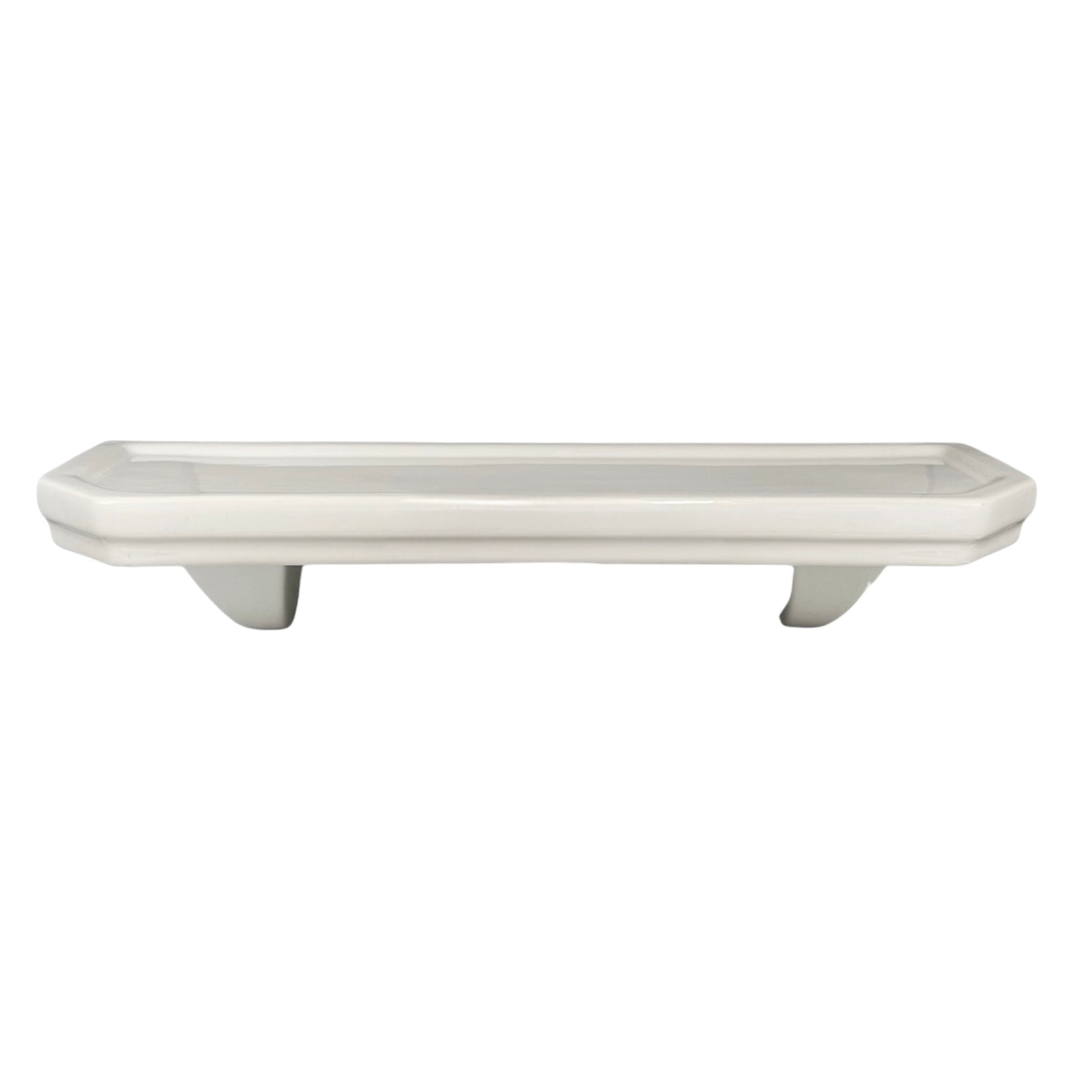 White ceramic planter with decorative feet on a white background