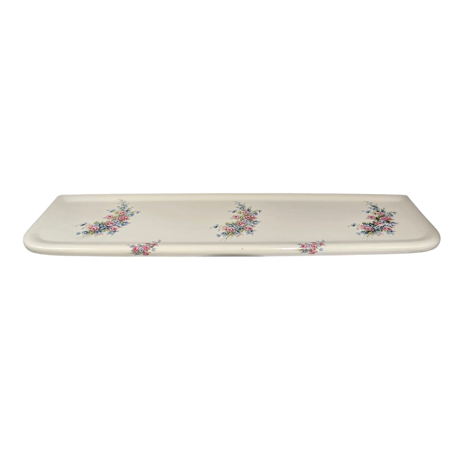 French ceramic floral patterned white shelf, wall mounted, shown against a plain white background