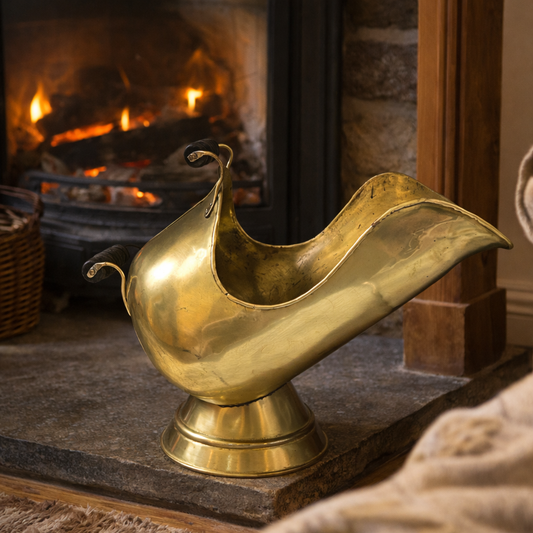 Gold ewer on a stone surface with a fireplace in the background