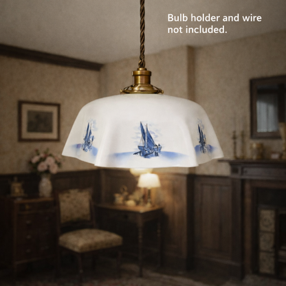 Vintage-style pendant light with sailboat design in a room setting.