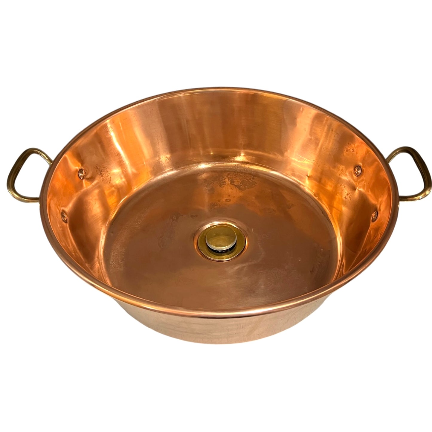 A round copper sink with two side handles and a central drain opening, shown on a plain white background.