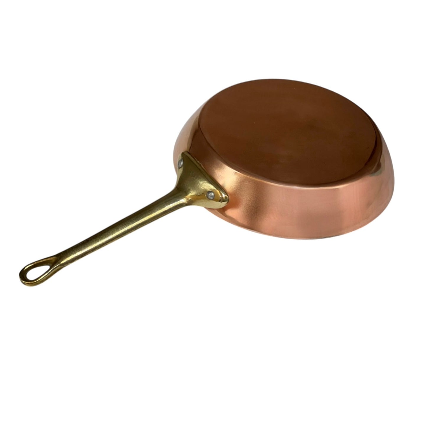 A copper skillet pan with a brass handle and loop, shown from a side angle on a plain white background.