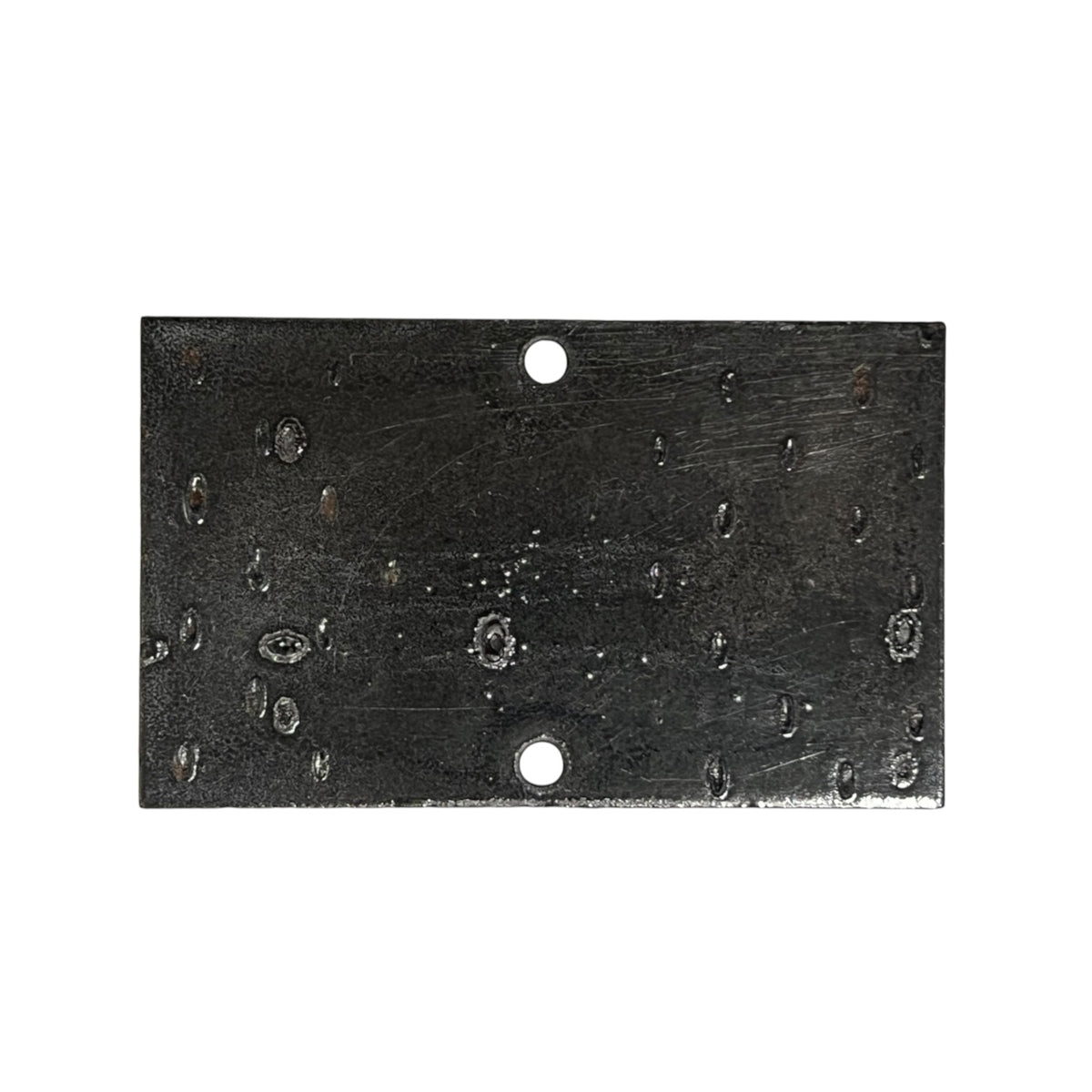 A rectangular black metal plate with two pre-drilled holes, one at the top center and one at the bottom center, featuring a textured, scratched, and weathered finish.