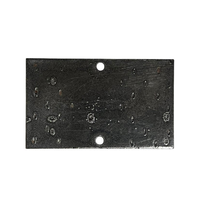 A rectangular black metal plate with two pre-drilled holes, one at the top center and one at the bottom center, featuring a textured, scratched, and weathered finish.