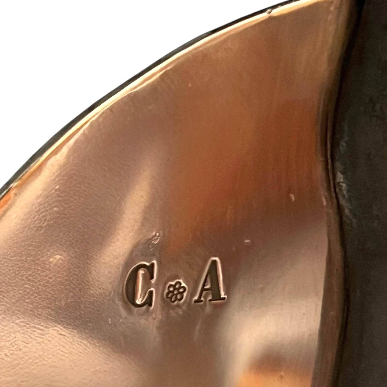 owners initials C and A on copper pan lid