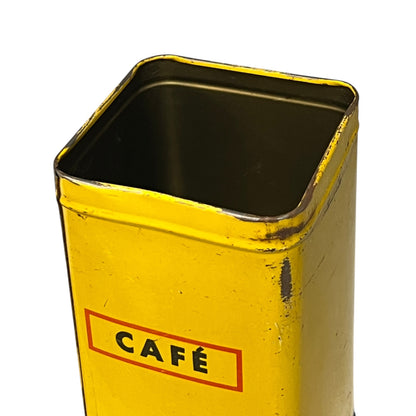 Vintage tin can with a colourful design featuring a face and 'Banania' branding on a white background.