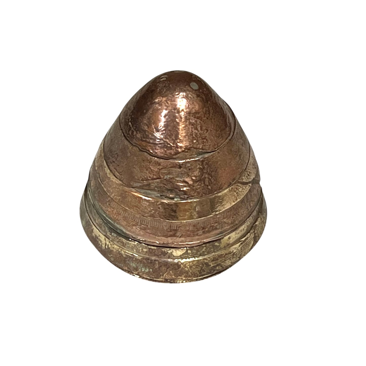 WW1 brass fuse now repurposed as a paperweight, with markings for identification of wear, on a white background
