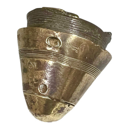 WW1 brass fuse paperweight on a white background