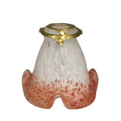 Bell shaped mottled coral coloured glass lampshade with a brass collar shown on a white background 