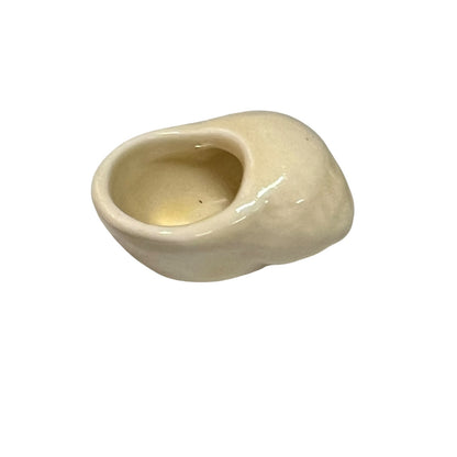 Beige ceramic snail-shaped bowl on a white background