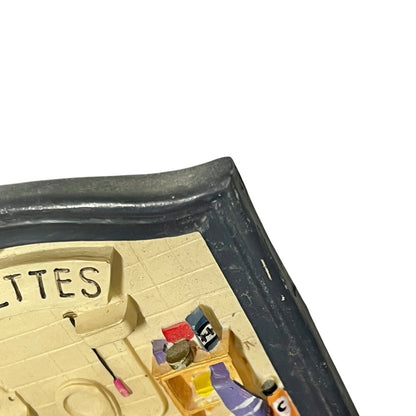 Close-up of a toilet door sign on a white background