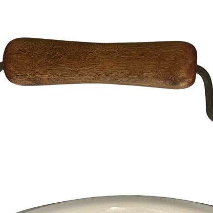 Close up of a vintage enamel lidded white bucket on a white background