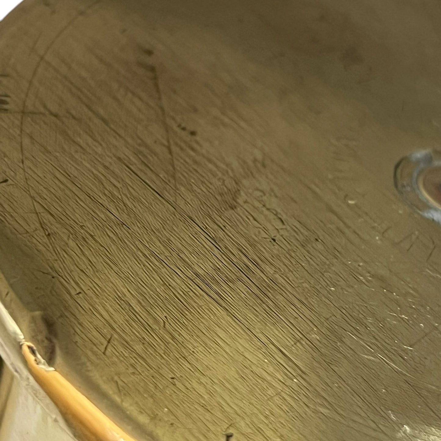 Close up of a brass WW1 German shell case on a white background