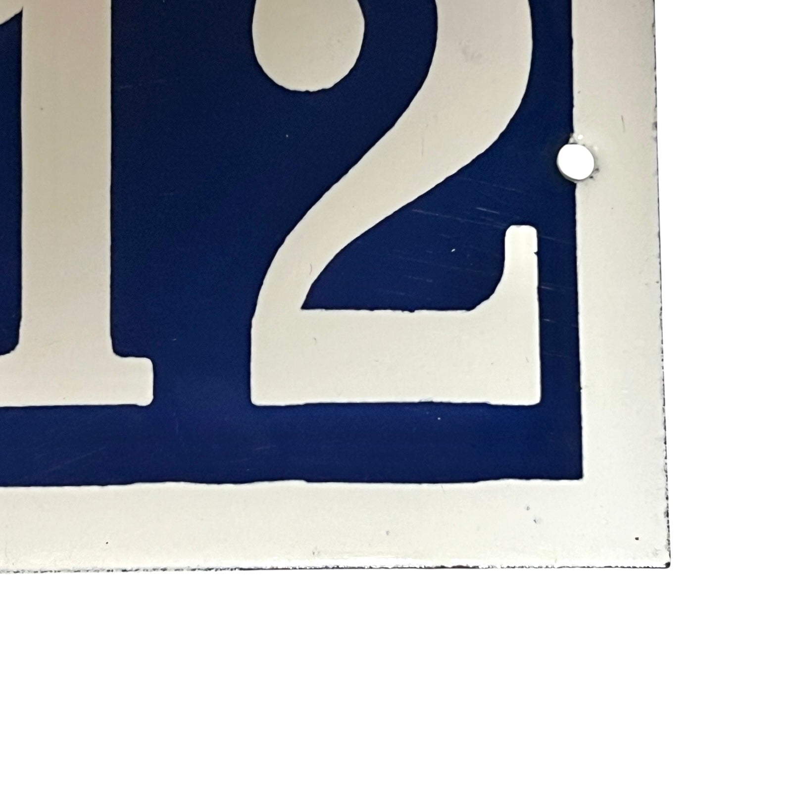 Close up of a French door number on a white background