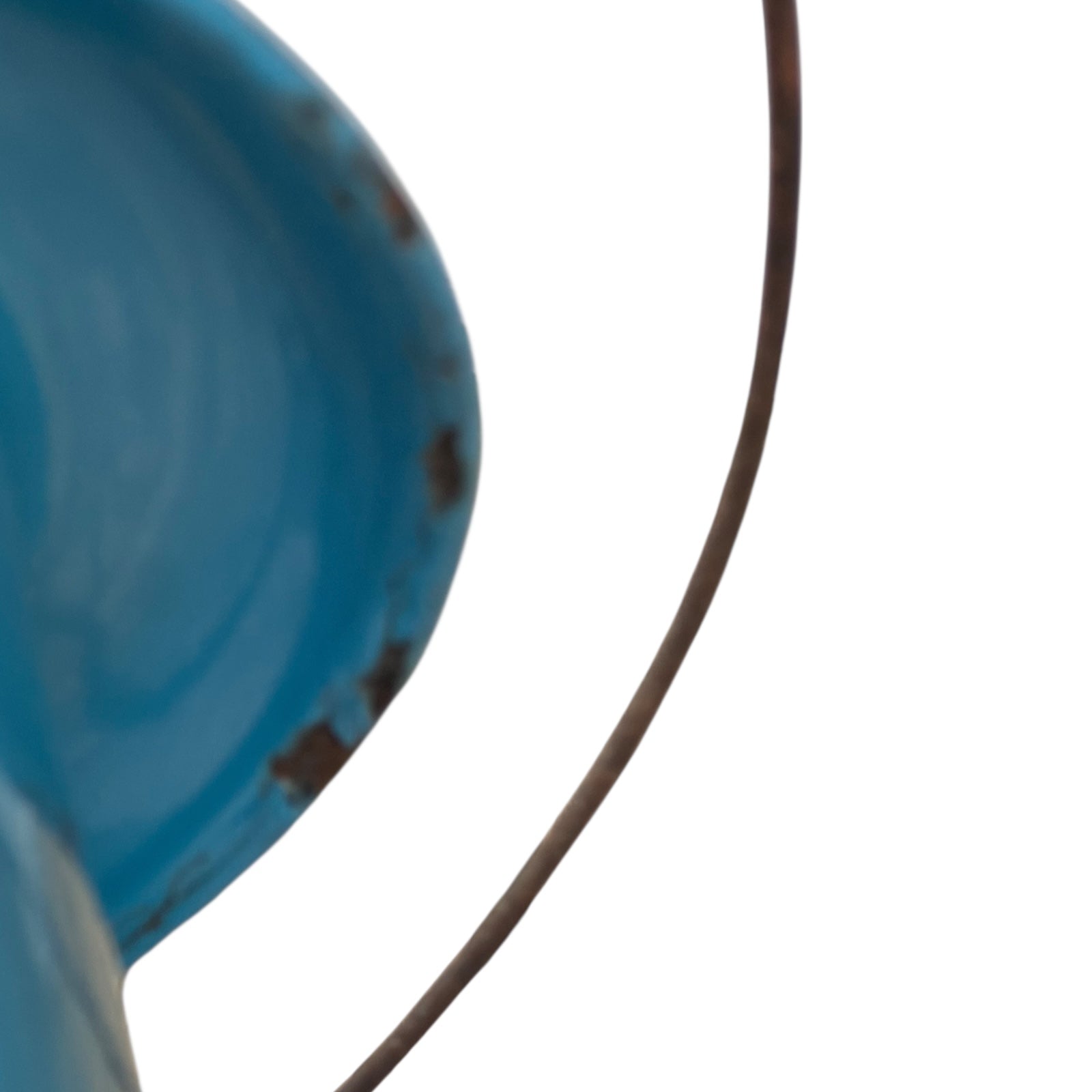 Close up of blue metal bucket with a wooden handle on a white background