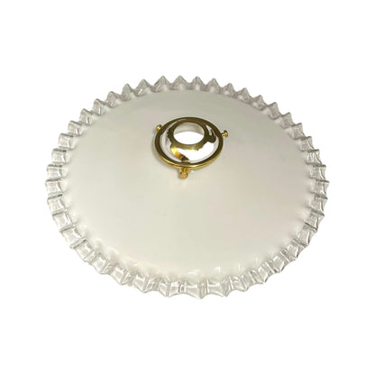 A round white glass lampshade with a scalloped edge and a central gold-tone metal ring handle, shown on a plain white background.