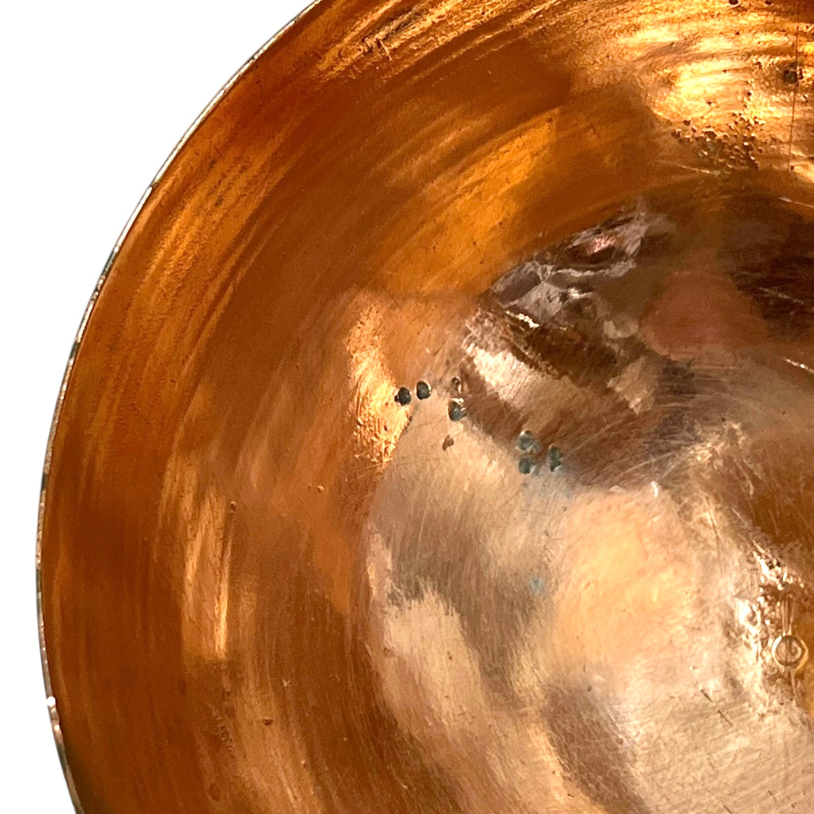 Close up of a French copper handmade ladle on a white background