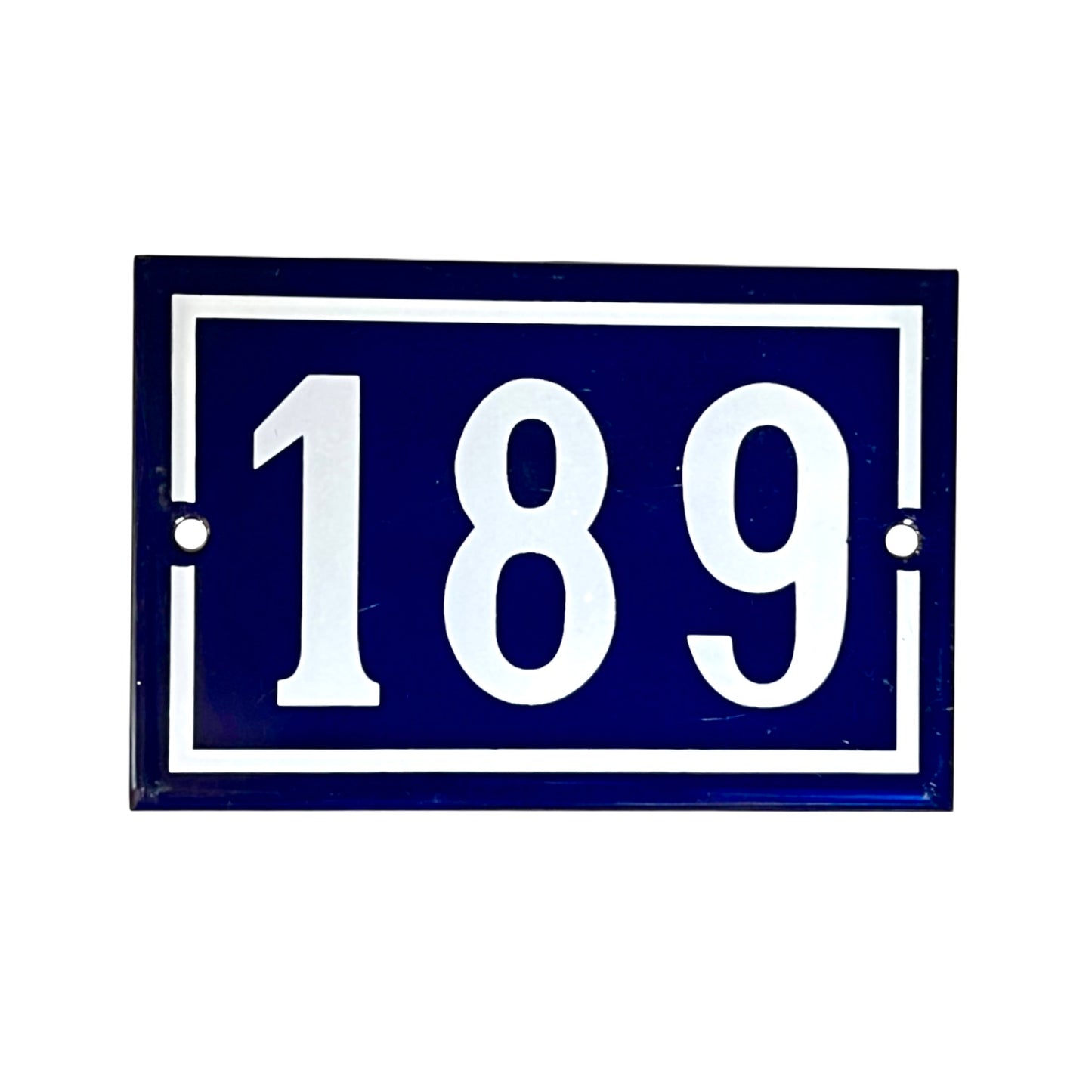A rectangular blue house number plaque with white border and white numerals '189' on a plain white background.