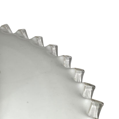 close up of lampshade rim on a white background
