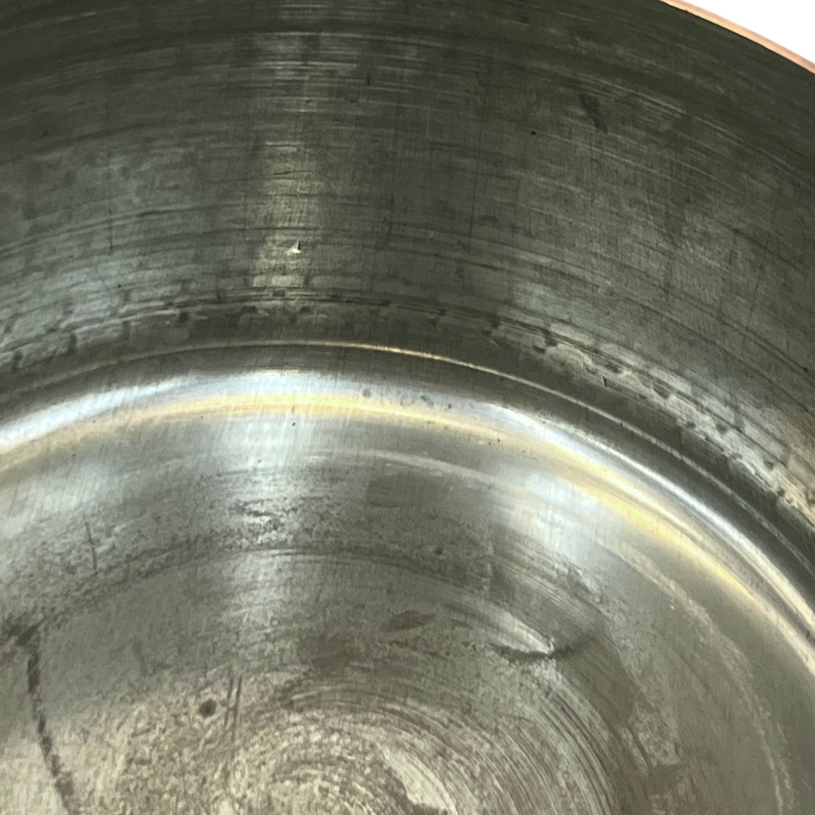 close up of copper pan tin lined inner