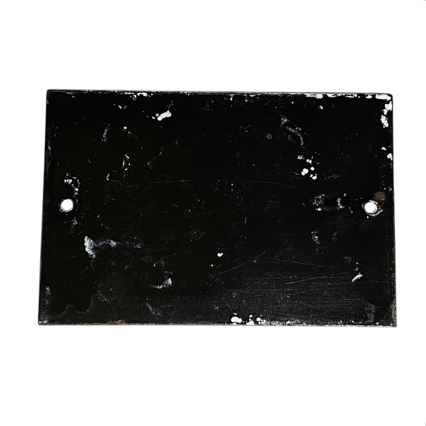 Back view of a French enamel door number on a white background