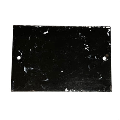 Back view of a French enamel door number on a white background