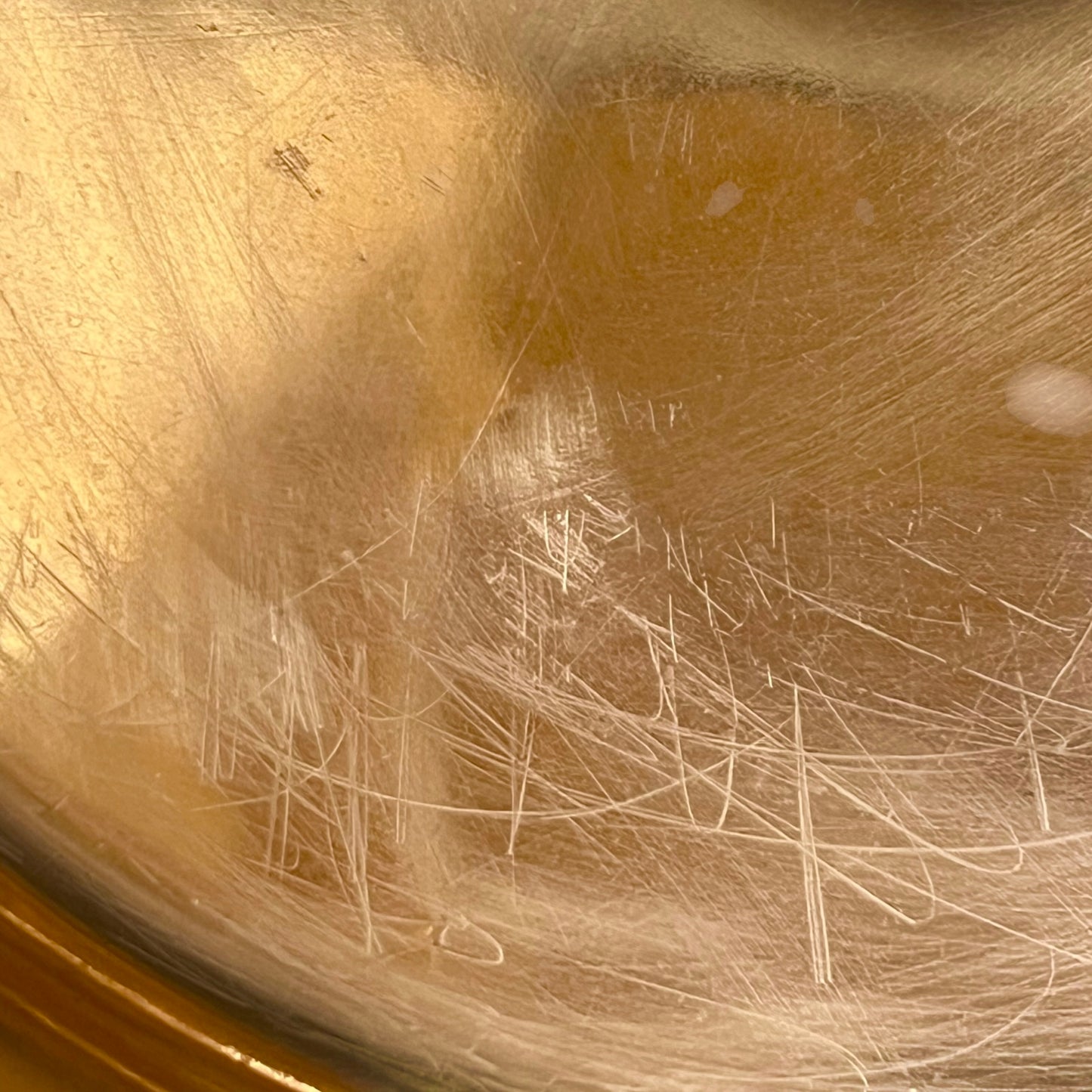 Close-up of the interior bottom of a copper sink or basin