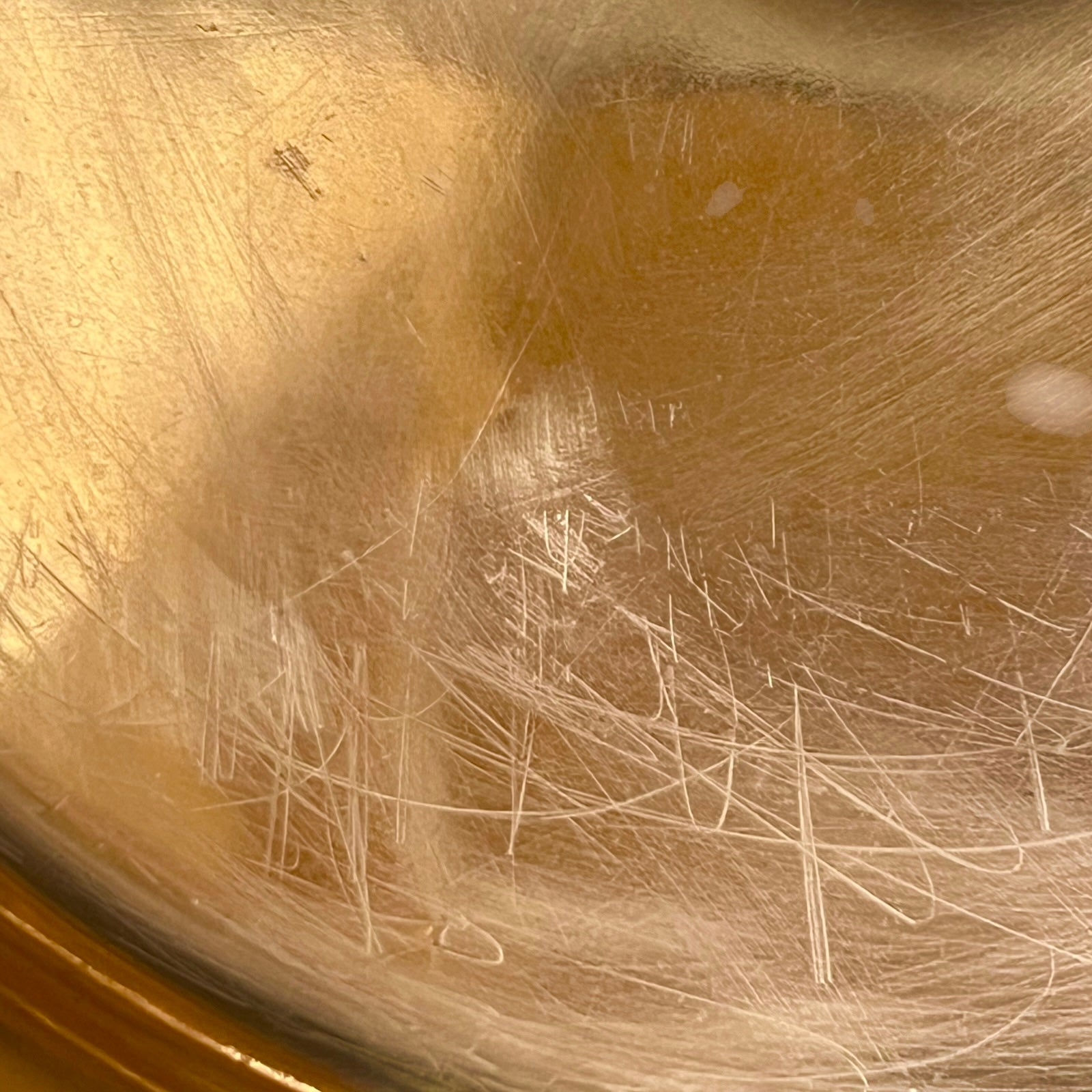 Close-up of the interior bottom of a copper sink or basin