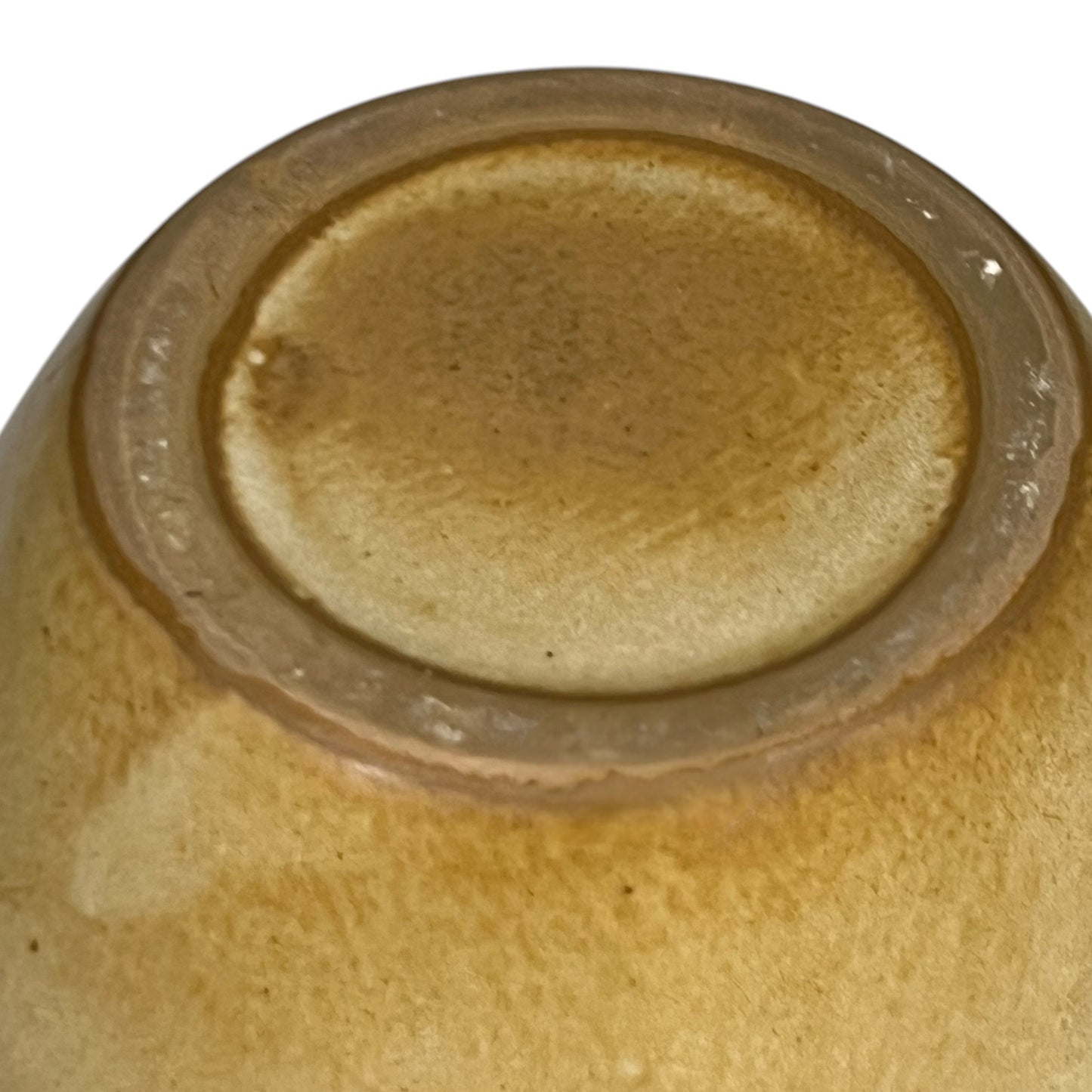 Base view of ceramic pitcher on a white background