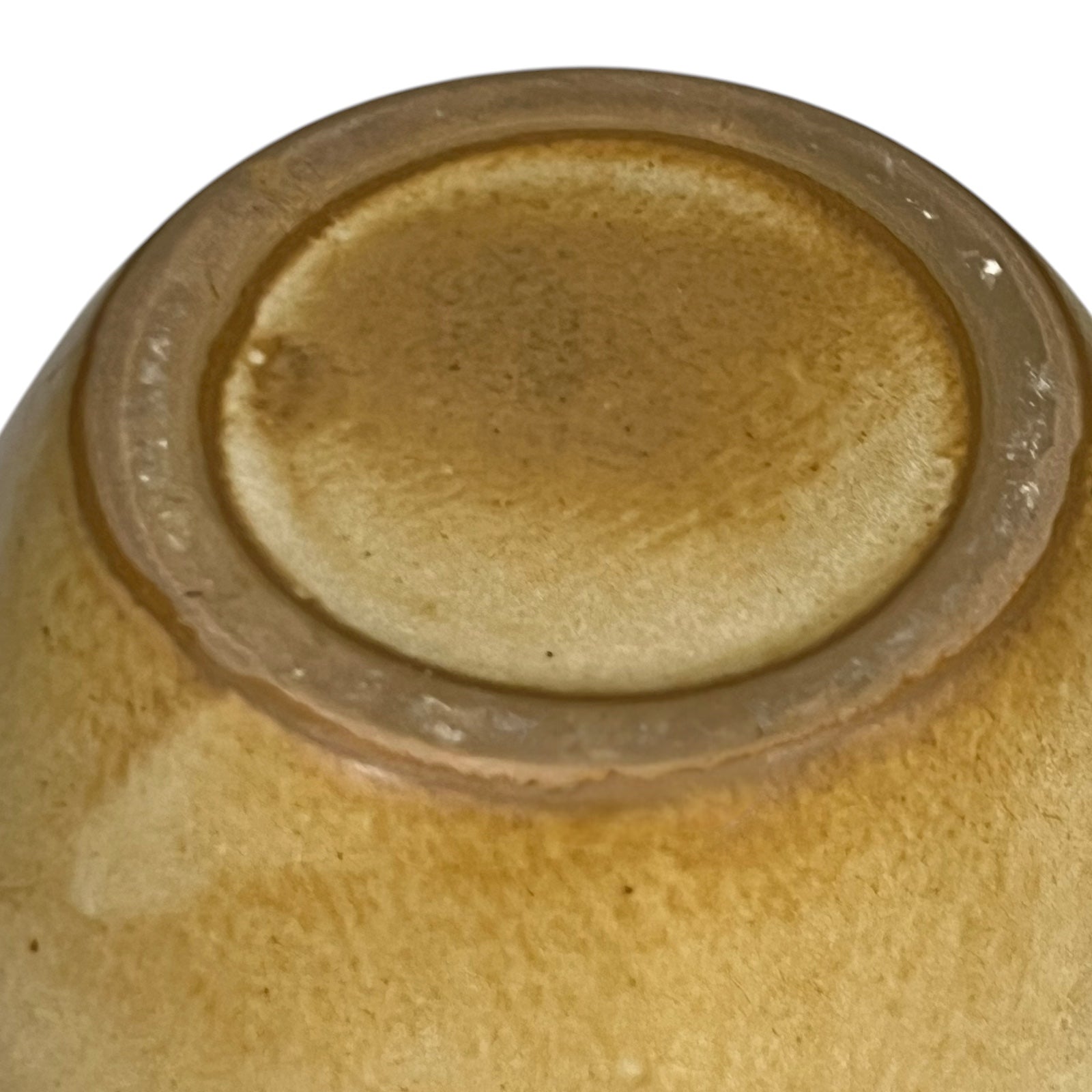 Base view of ceramic pitcher on a white background