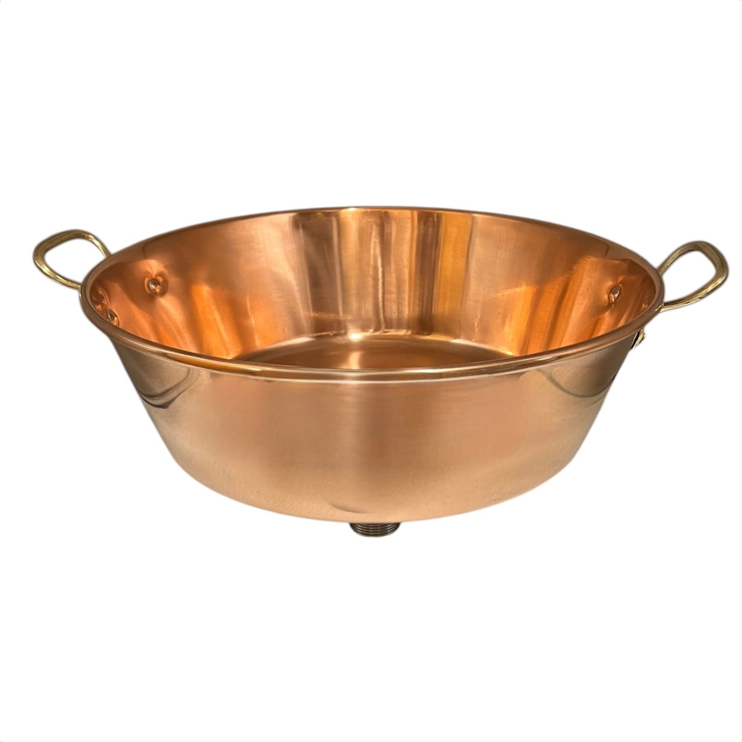 Close-up of a copper sink with a drain plug on a white background