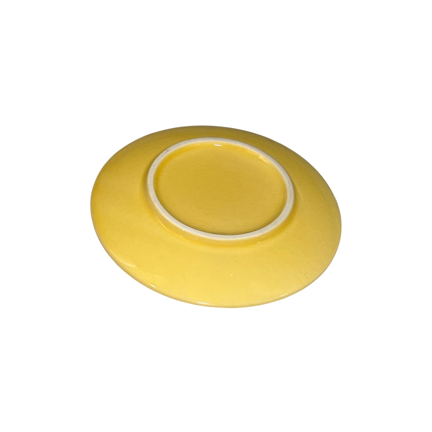 Yellow ceramic plate on a white background