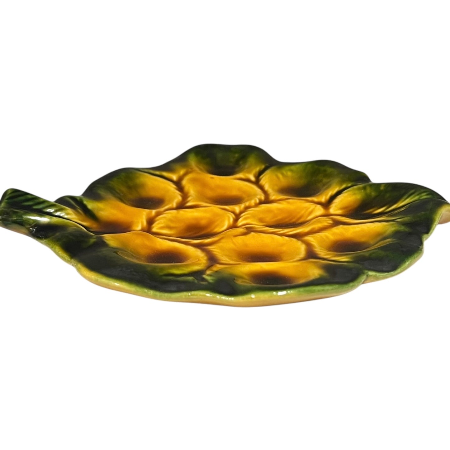 Yellow and green ceramic leaf-shaped snail escargots plate on a white background